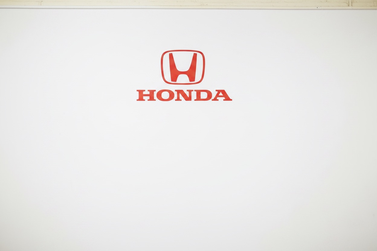 Honda logo on a dealership wall
