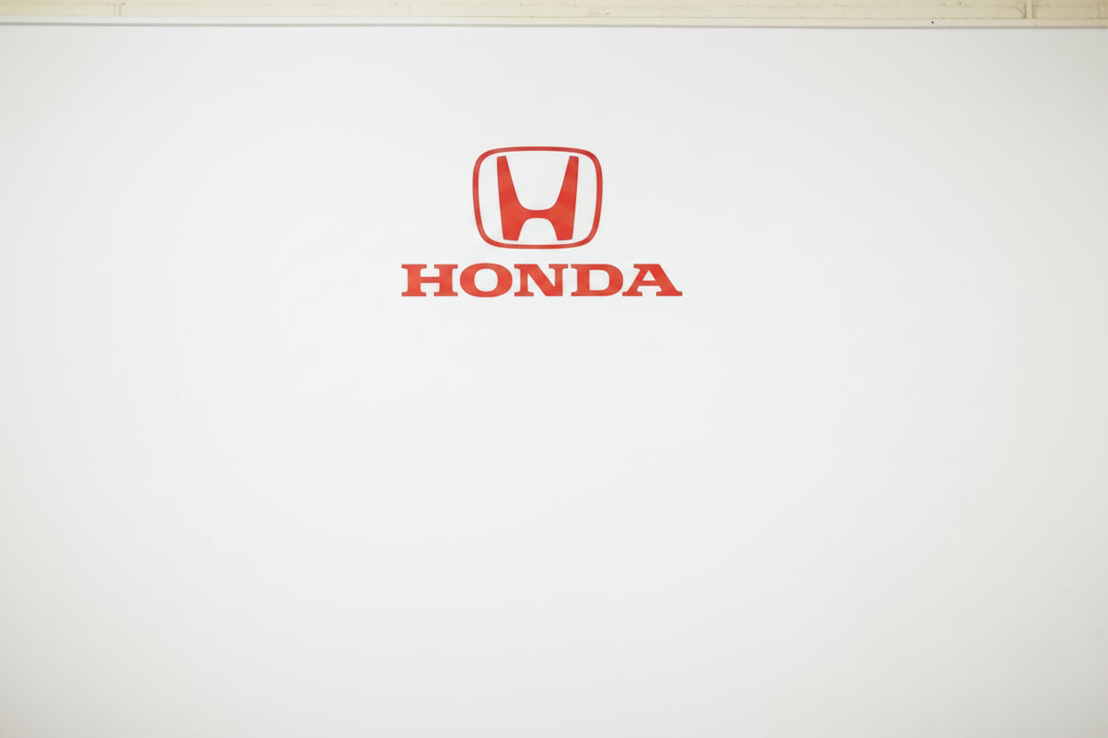 Honda logo on a dealership wall
